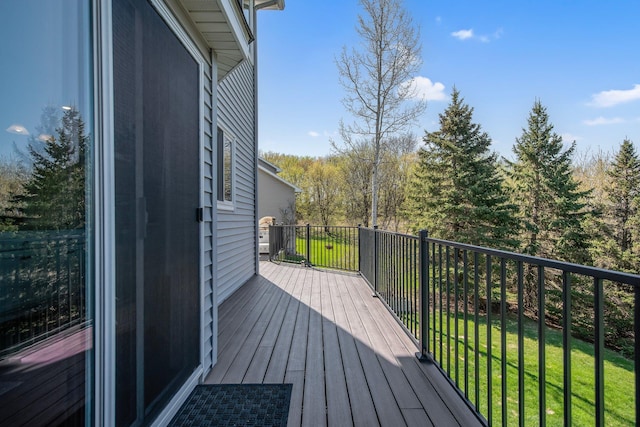 wooden terrace with a lawn