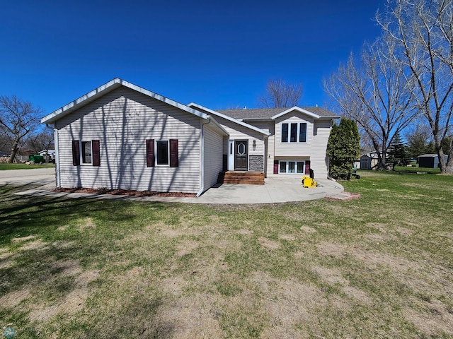 rear view of property with a yard