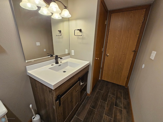 bathroom with vanity and wood tiled floor