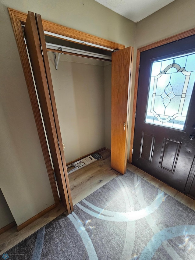 foyer entrance with wood finished floors