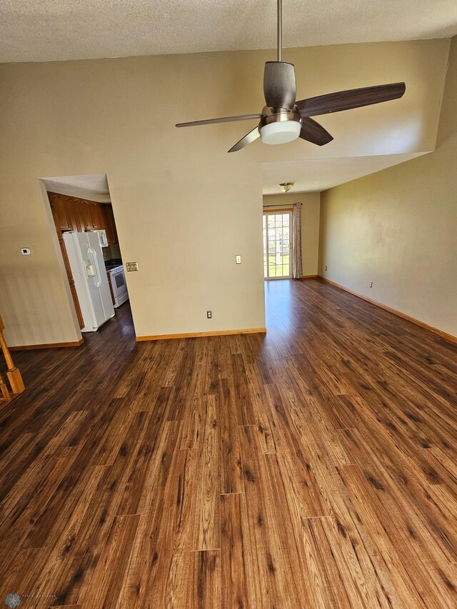 unfurnished room featuring baseboards, a ceiling fan, and dark wood-style floors