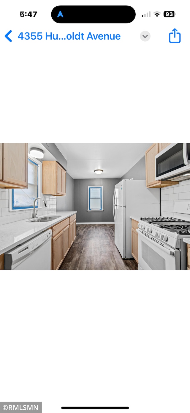 4355 Humboldt Ave N, Minneapolis, MN 55412 - kitchen featuring white appliances, light brown cabinetry, a sink, decorative backsplash, and dark wood-style floors