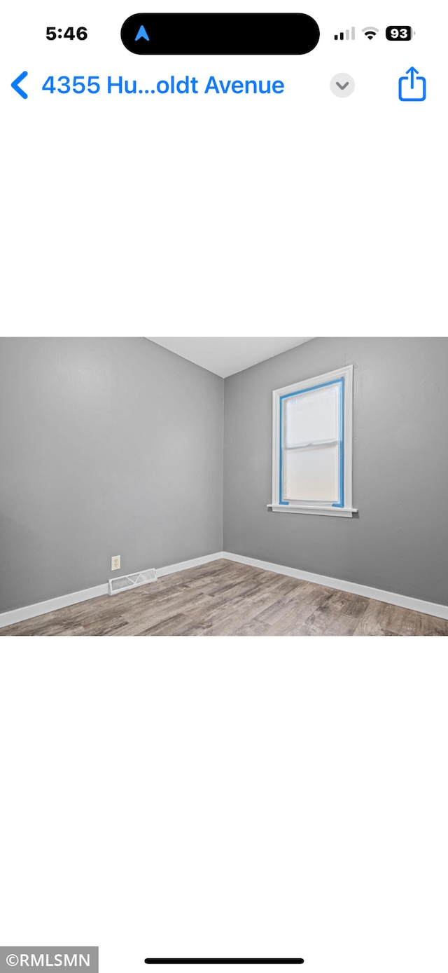 4355 Humboldt Ave N, Minneapolis, MN 55412 - empty room featuring wood finished floors and baseboards