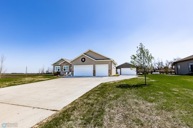 view of front of house featuring concrete driveway, a garage, a front lawn, and stone siding