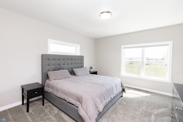 carpeted bedroom with baseboards