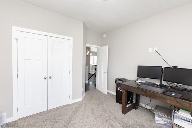 office area featuring carpet floors, baseboards, and visible vents