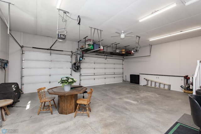 garage with a garage door opener and ceiling fan