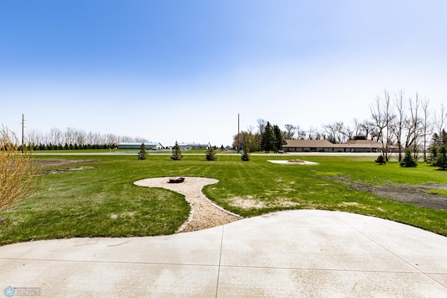 view of property's community with a yard