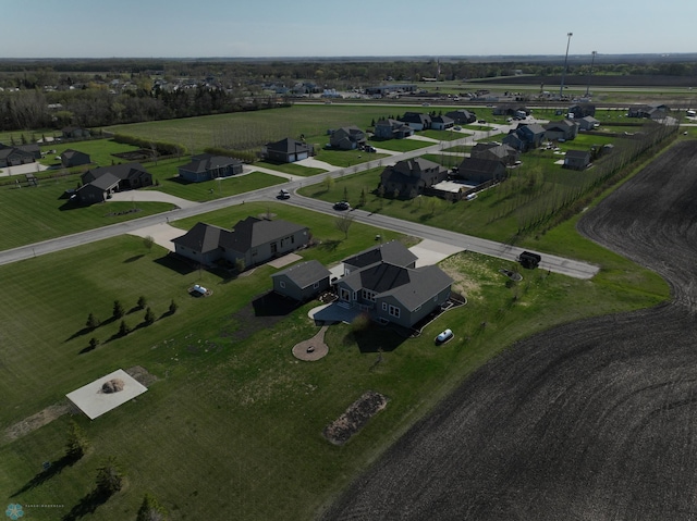 aerial view of property and surrounding area with nearby suburban area