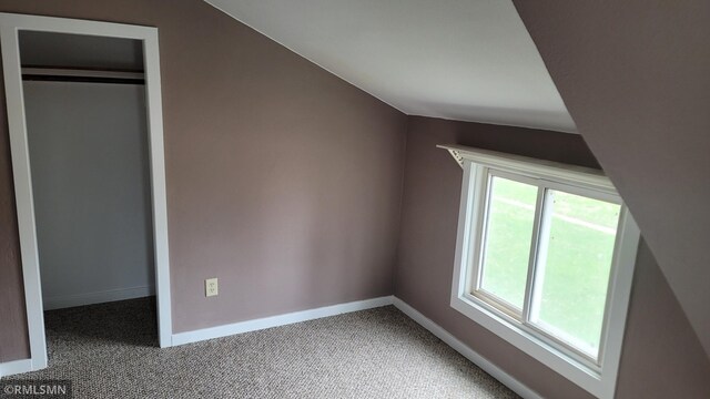 bonus room with baseboards, carpet flooring, and vaulted ceiling