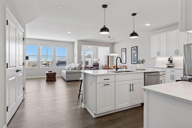 173 Junco Rd N, Lake Elmo, MN 55042 - kitchen featuring a sink, recessed lighting, appliances with stainless steel finishes, white cabinets, and dark wood-style floors