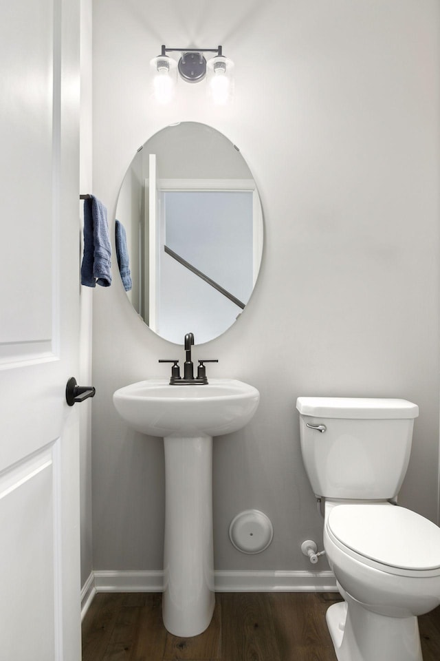 173 Junco Rd N, Lake Elmo, MN 55042 - bathroom featuring baseboards, wood finished floors, and toilet