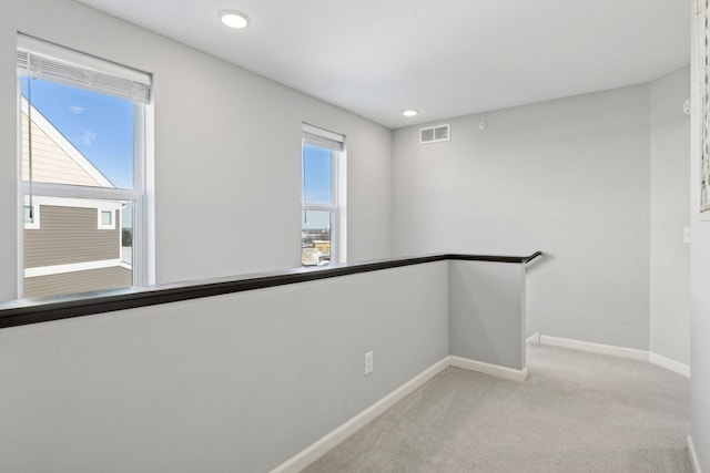 173 Junco Rd N, Lake Elmo, MN 55042 - unfurnished room featuring baseboards, light colored carpet, and recessed lighting