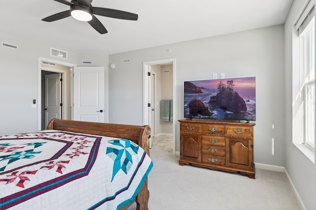 173 Junco Rd N, Lake Elmo, MN 55042 - bedroom with light carpet, baseboards, a ceiling fan, and ensuite bath