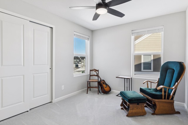 173 Junco Rd N, Lake Elmo, MN 55042 - living area with carpet flooring, a ceiling fan, and baseboards
