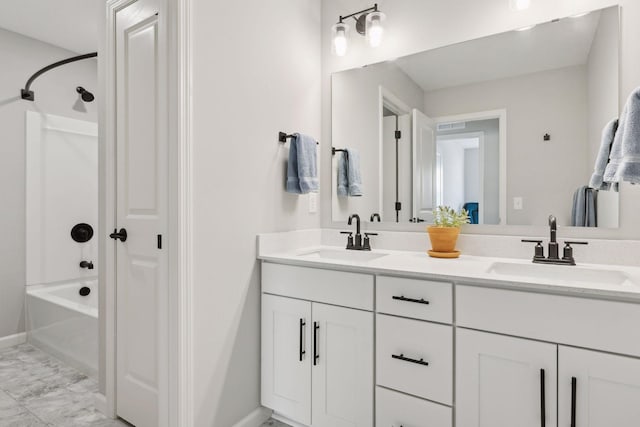 173 Junco Rd N, Lake Elmo, MN 55042 - bathroom featuring bathing tub / shower combination, double vanity, marble look tiles, and baseboards