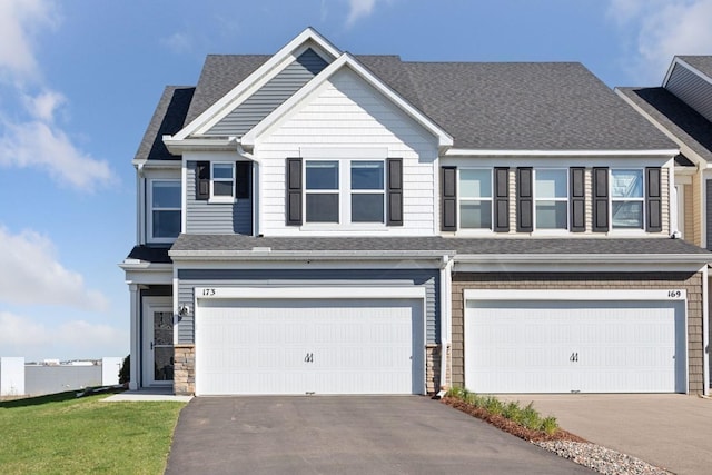 173 Junco Rd N, Lake Elmo, MN 55042 - craftsman house with a garage, asphalt driveway, and roof with shingles