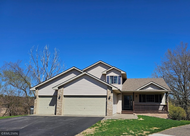 view of front of property featuring covered porch, roof with shingles, a garage, brick siding, and aphalt driveway