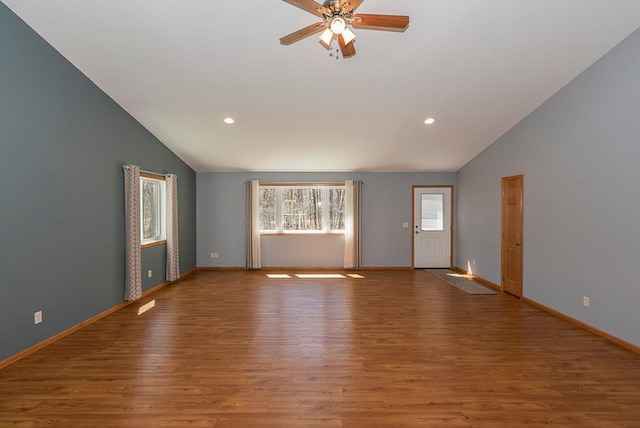 10098 Pin Oak Ln, Brainerd, MN 56401 - unfurnished living room featuring recessed lighting, ceiling fan, vaulted ceiling, and wood finished floors