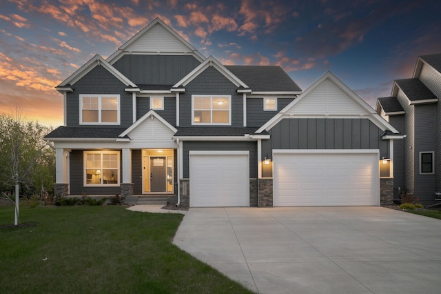 craftsman inspired home featuring driveway, stone siding, and board and batten siding