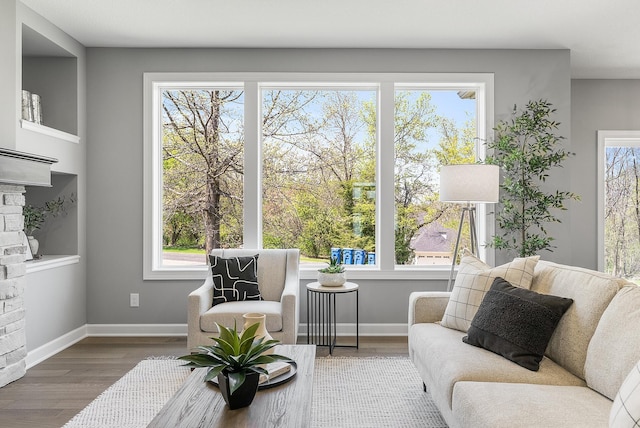 sitting room featuring wood finished floors and baseboards