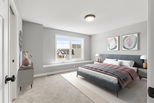 carpeted bedroom with baseboards