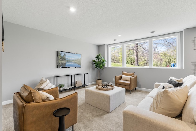 living room with light colored carpet, a textured ceiling, baseboards, and recessed lighting