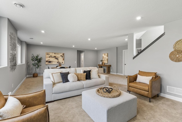 living room featuring light carpet, recessed lighting, and baseboards