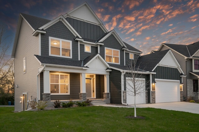 craftsman-style home with board and batten siding, stone siding, driveway, and a garage
