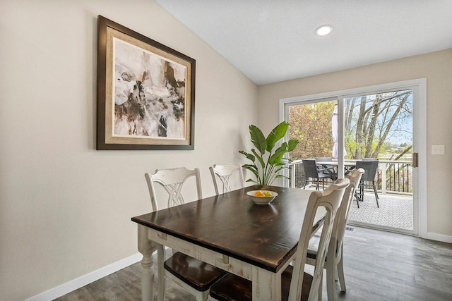 dining room with wood finished floors, baseboards, and recessed lighting