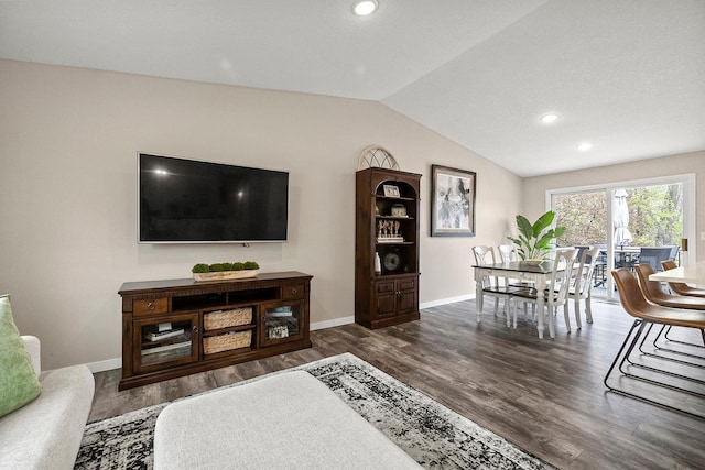 living area featuring baseboards, wood finished floors, recessed lighting, and vaulted ceiling