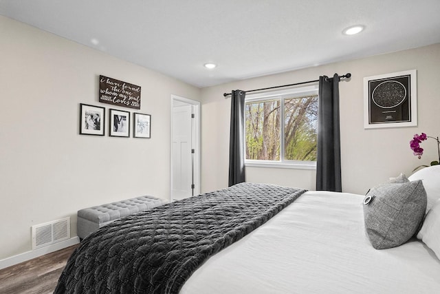 bedroom with recessed lighting, baseboards, visible vents, and wood finished floors
