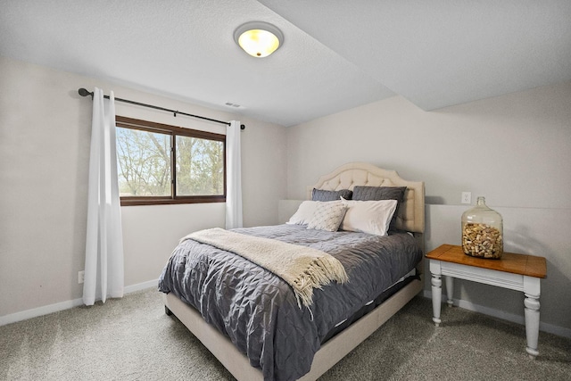 bedroom with baseboards, visible vents, and carpet