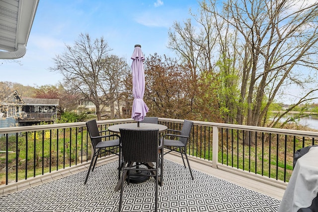 wooden terrace with outdoor dining area