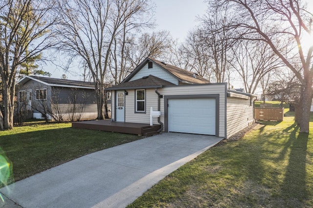 view of front of home with a garage, a front yard, and concrete driveway