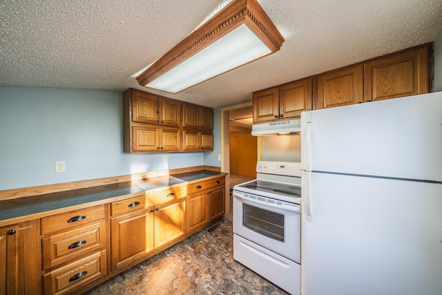 kitchen featuring brown cabinetry, under cabinet range hood, white appliances, and a textured ceiling