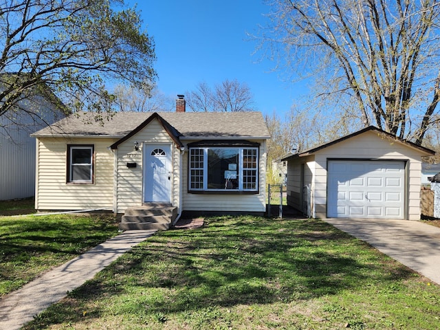 view of front of house featuring an outdoor structure, a garage, a front yard, and a chimney