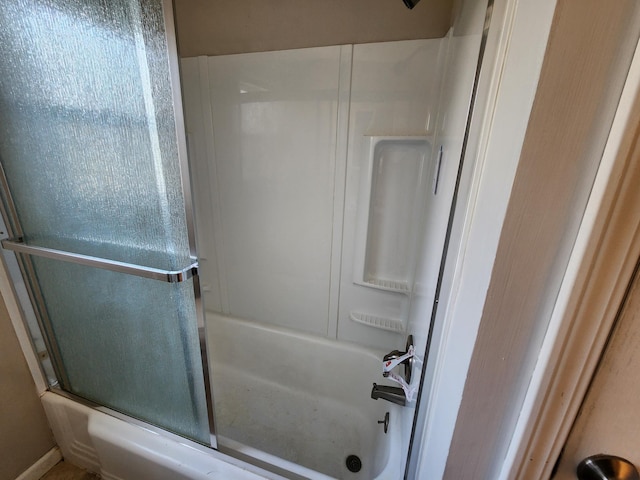 full bathroom featuring combined bath / shower with glass door