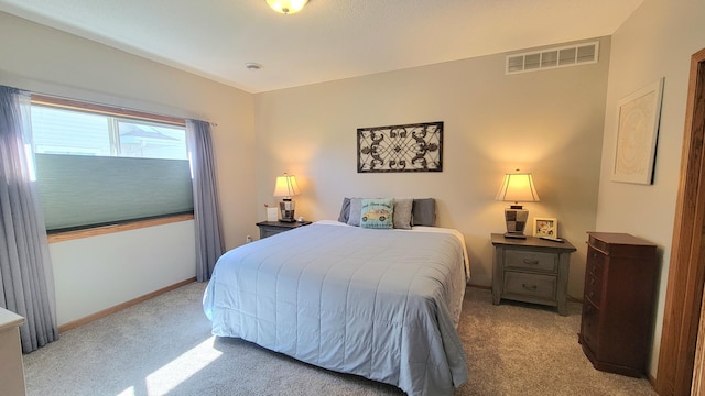 bedroom with baseboards, light colored carpet, and visible vents