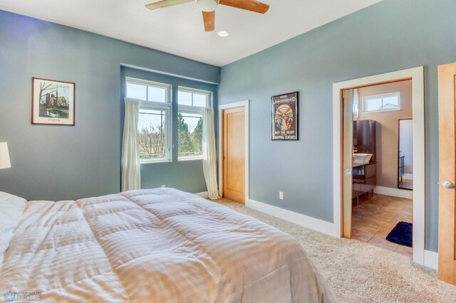 carpeted bedroom with baseboards, a ceiling fan, and tile patterned floors