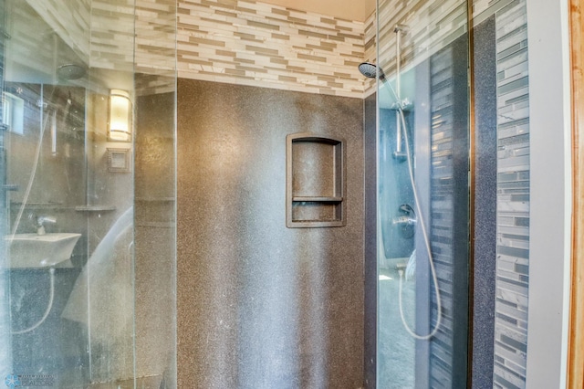 full bathroom with a sink and a stall shower