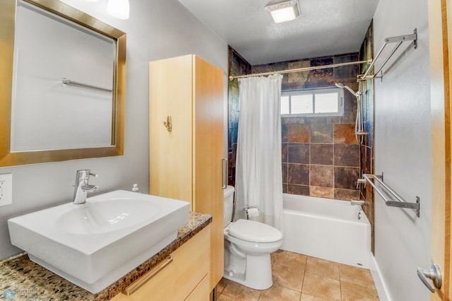 full bathroom featuring vanity, toilet, tile patterned flooring, and shower / tub combo with curtain
