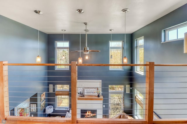 details featuring a glass covered fireplace