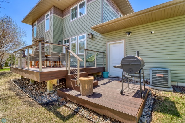 wooden deck featuring a grill and central AC
