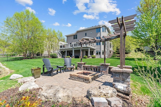 rear view of house featuring stairs, an outdoor fire pit, a wooden deck, a pergola, and a patio area