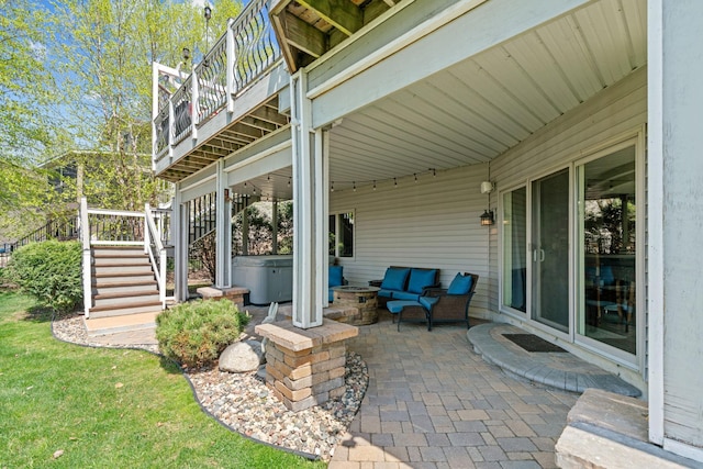 view of patio featuring a hot tub, stairway, and a deck