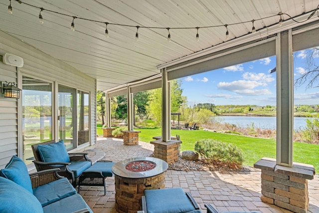 view of patio / terrace featuring a water view and an outdoor hangout area
