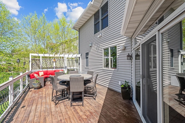 wooden terrace with outdoor lounge area and outdoor dining space