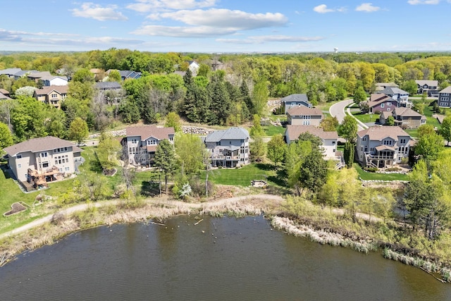 aerial view of residential area with a large body of water