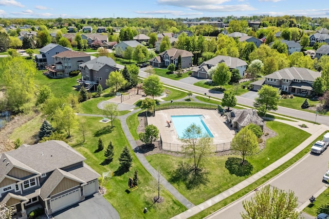 aerial perspective of suburban area featuring a pool